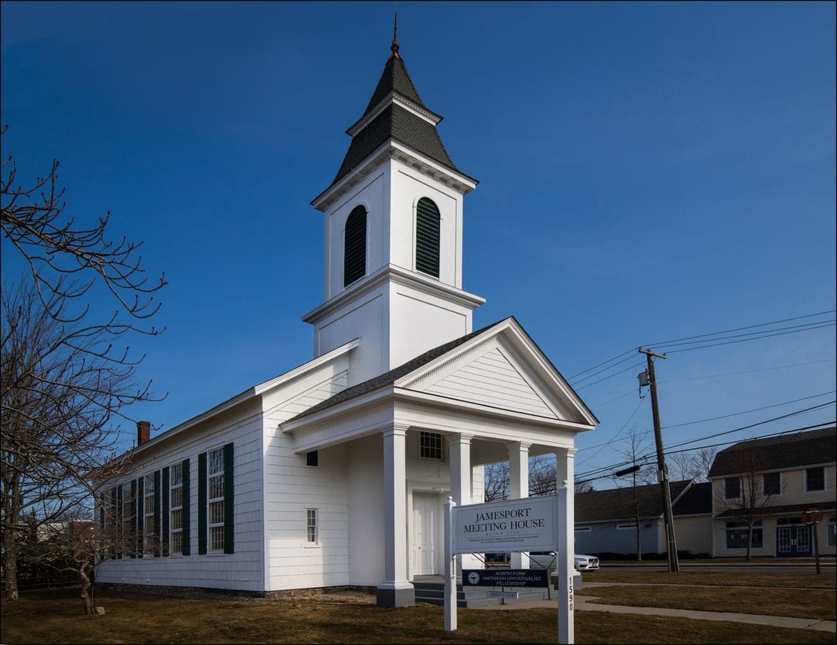 The building's own street sign is in frame reading 'Jamesport Meeting House, 1590' — matching this record's exact address.
