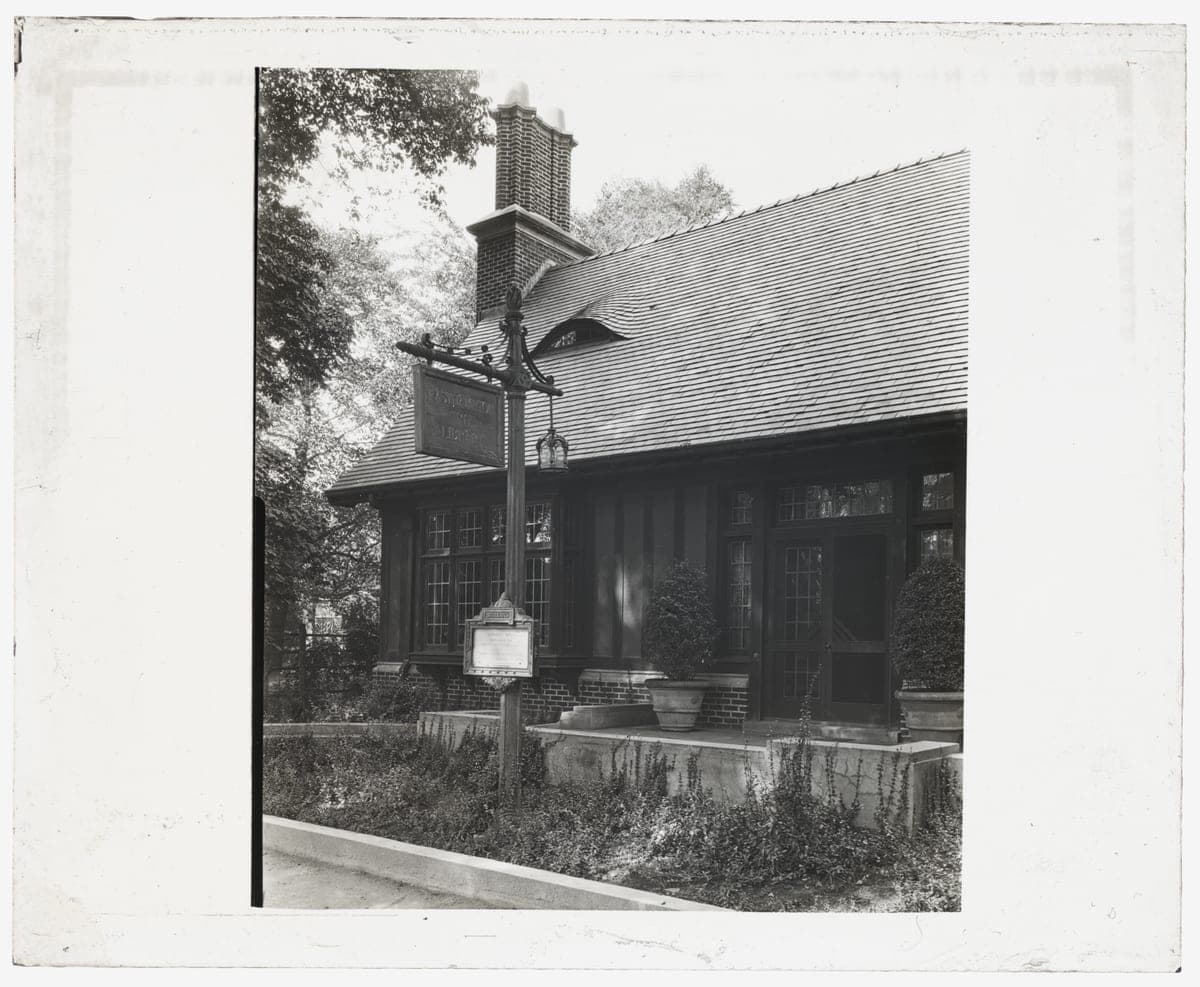 A ca. 1915 Frances Benjamin Johnston photograph, titled by the Library of Congress "East Hampton Free Library, 159 Main Street, East Hampton, New York. Entrance" — the post sign standing in the frame itself reads "EAST HAMPTON FREE LIBRARY," byte-identical to this record's address. Historic, not current — the building has since been expanded — used because no free-licensed modern exterior of it exists on Commons.